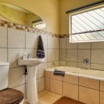 Interior of a Clean Tiled Bathroom